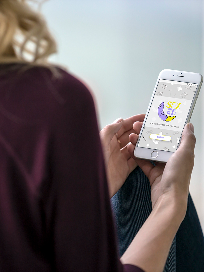 Person holding a smartphone displaying a sex education app with a purple condom illustration and an Enter button.