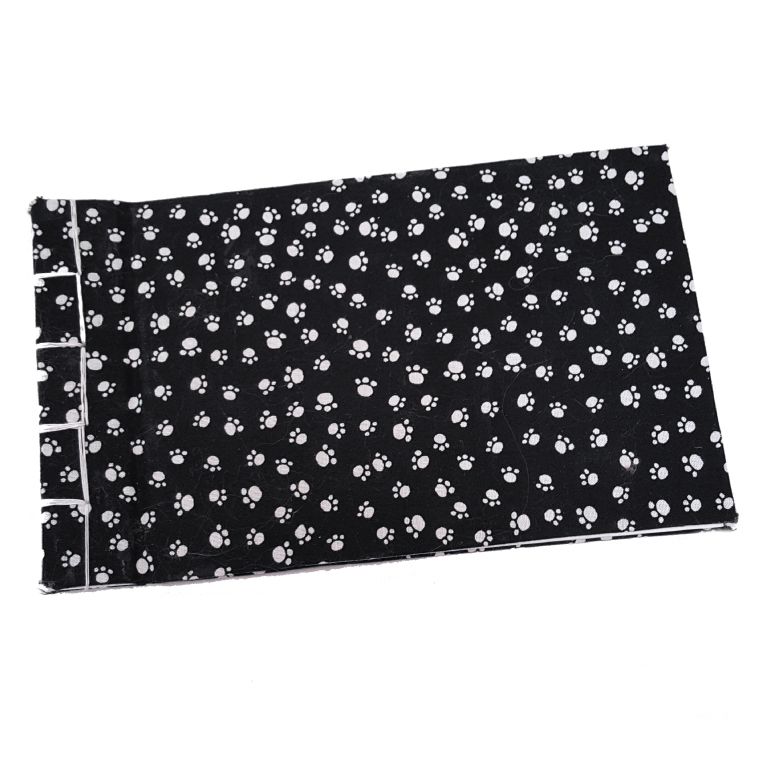 Black fabric with a white paw print pattern, folded and displayed on a white background.