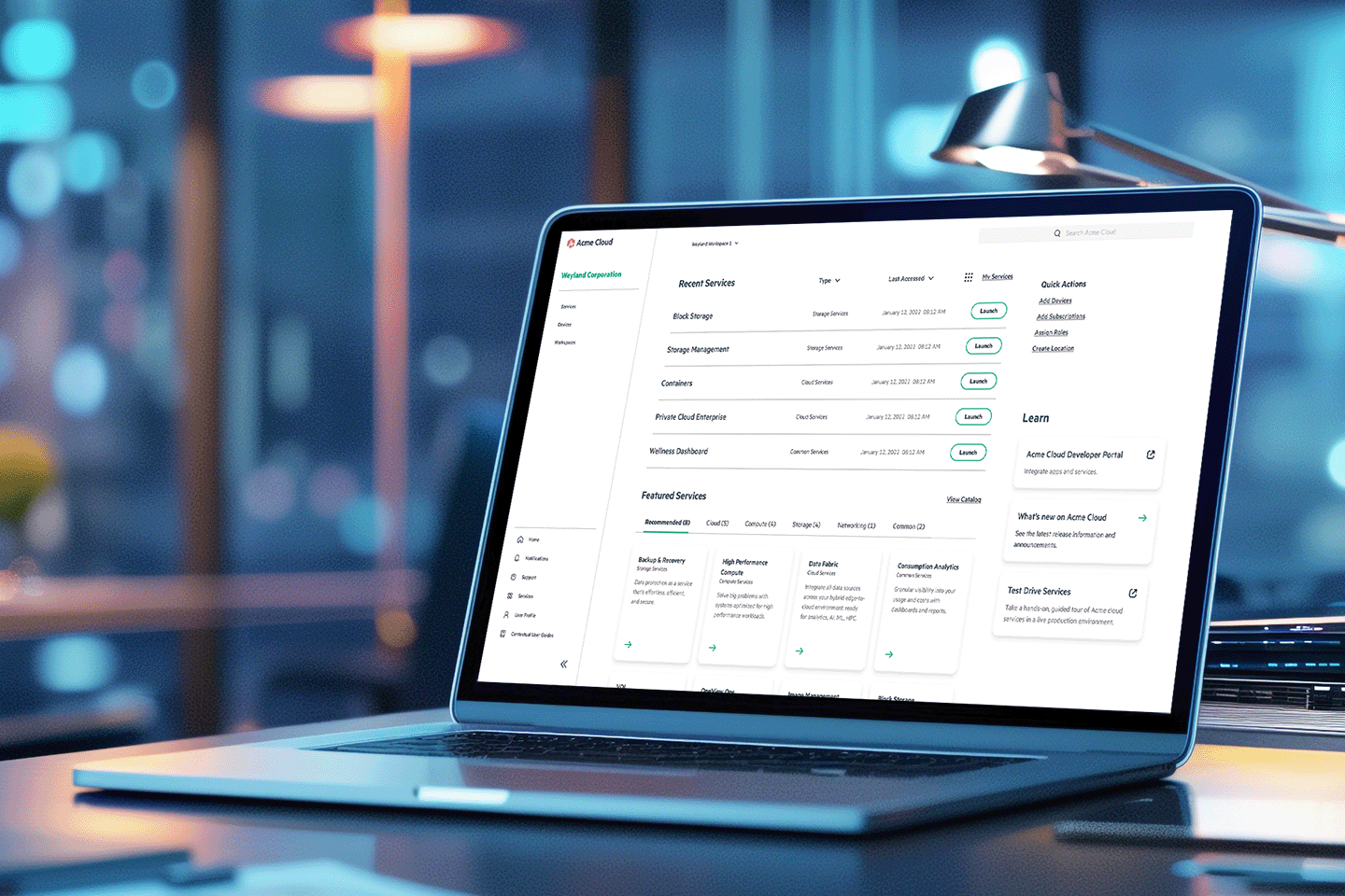 Open laptop on desk showing a cloud services dashboard with recent and featured services, actions, and navigation menu.
