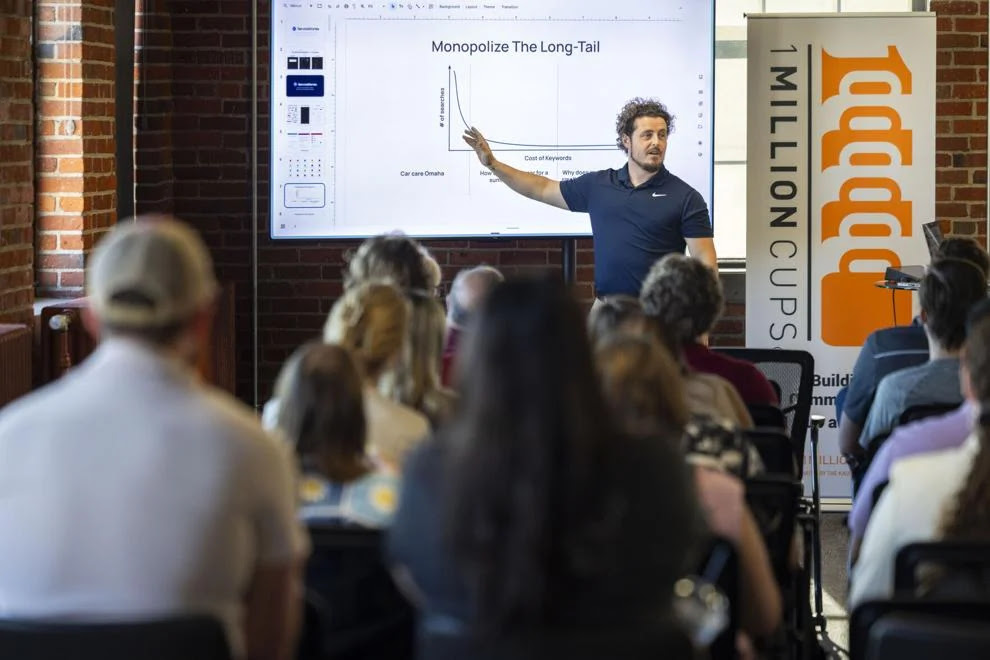 Joe speaking to a crowd about service stories