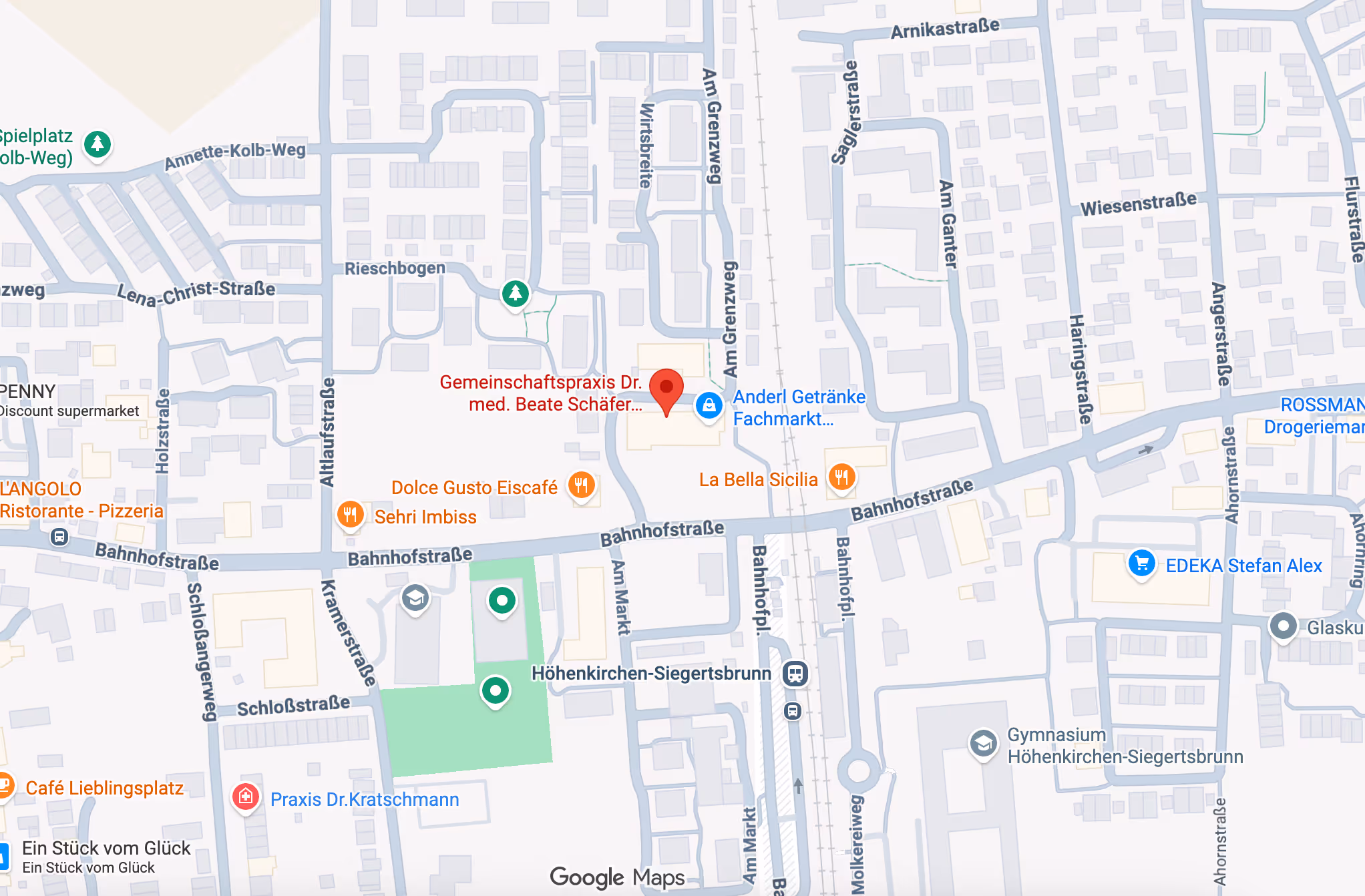 Map of Höhenkirchen-Siegertsbrunn showing streets, businesses, restaurants, a supermarket, and train station near Bahnhofstraße.