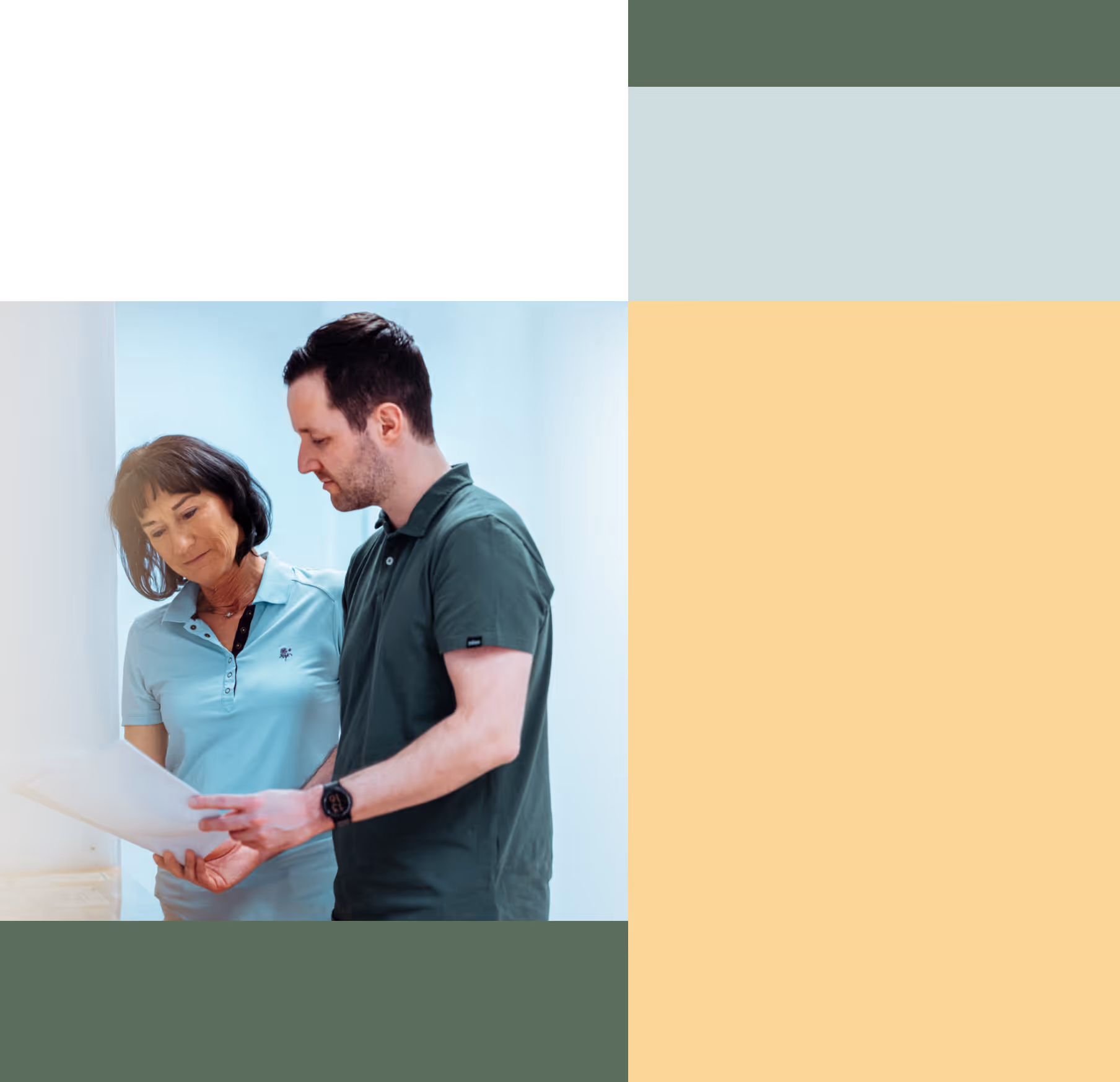 Man and woman standing indoors reviewing a document together.