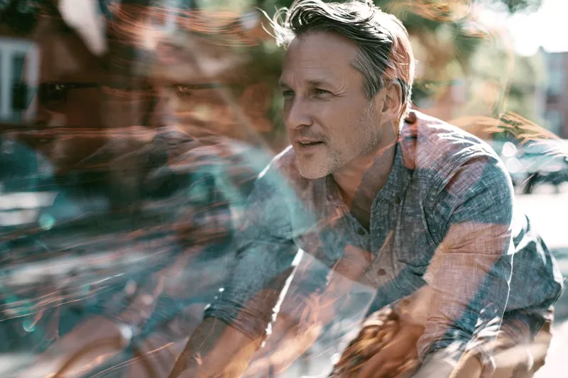 Man cycling through his neighborhood
