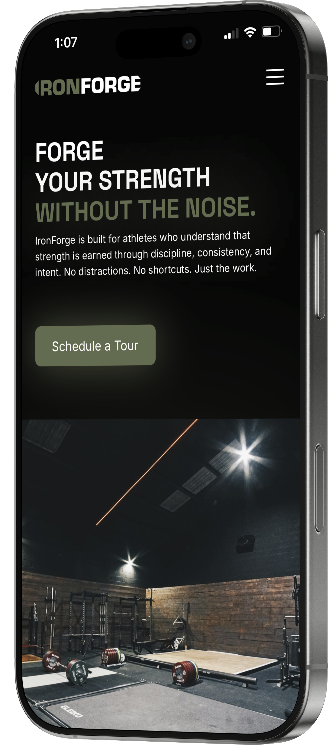 Smartphone screen showing IronForge website with a gym slogan, schedule button, and image of an empty weightlifting platform with barbells and racks.