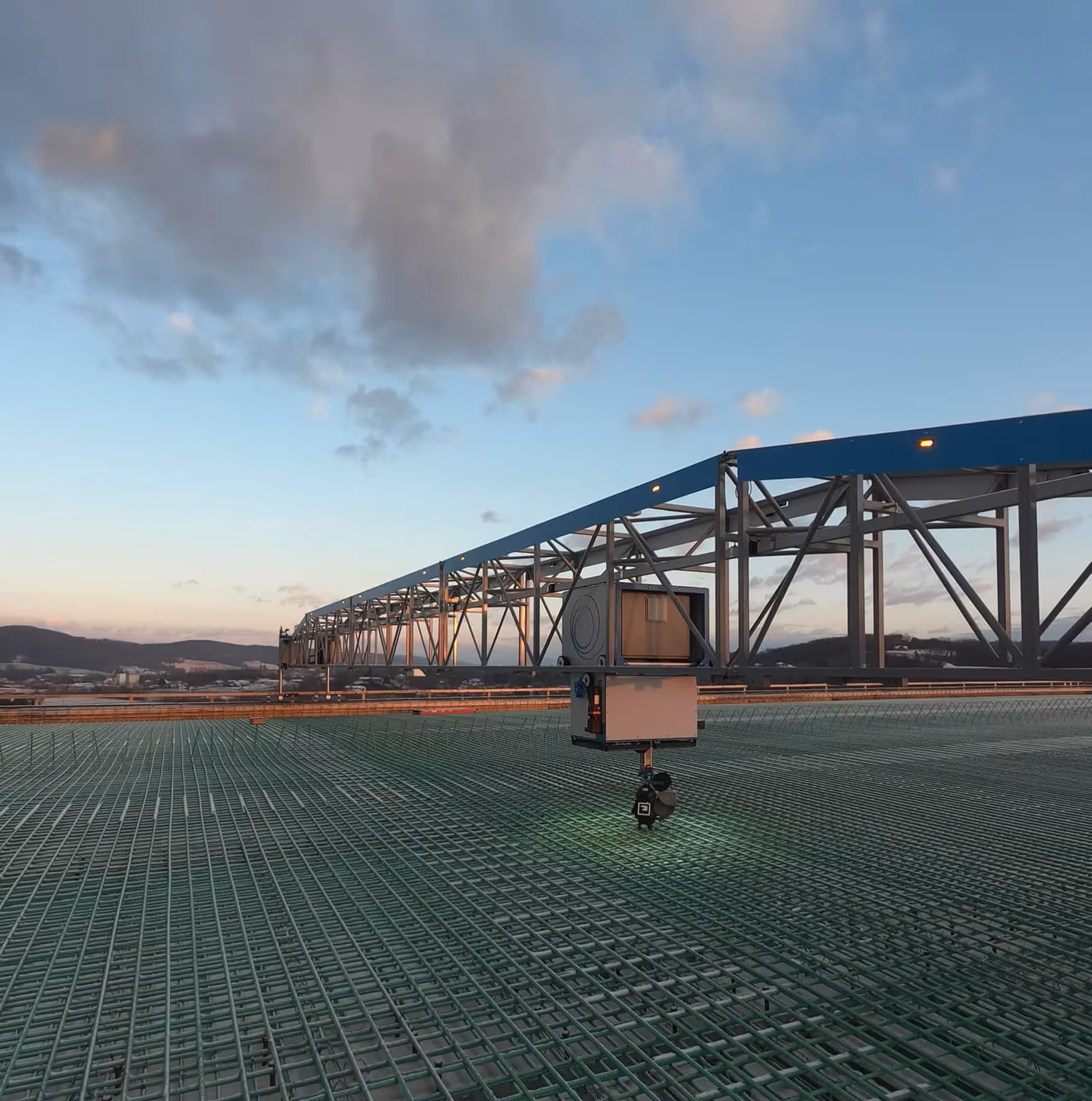 TyBOT autonomous rebar tying robot on a bridge deck, viewed from the side