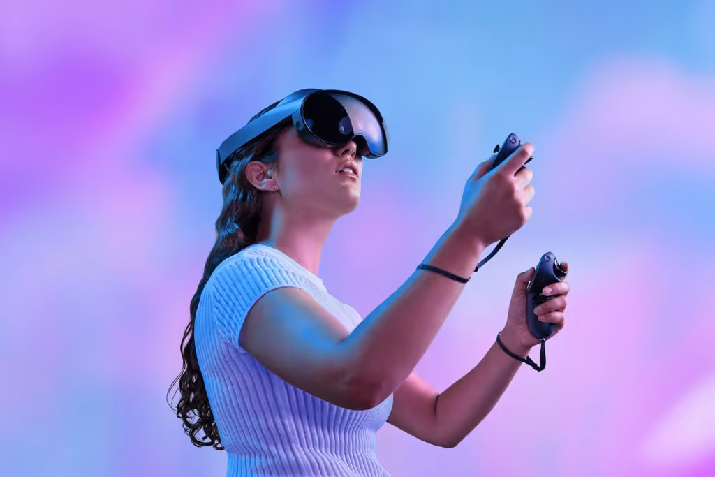 Woman wearing a VR headset and controllers for virtual production at Thunder Studios