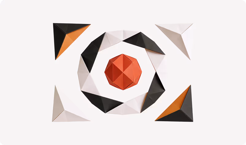 Geometric paper art with a red polygon in the center surrounded by alternating black and white folded shapes, with four black and orange triangular shapes at the corners on a white background.