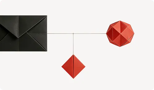 Black paper envelope connected by thin strings to two red geometric origami shapes on a white background.