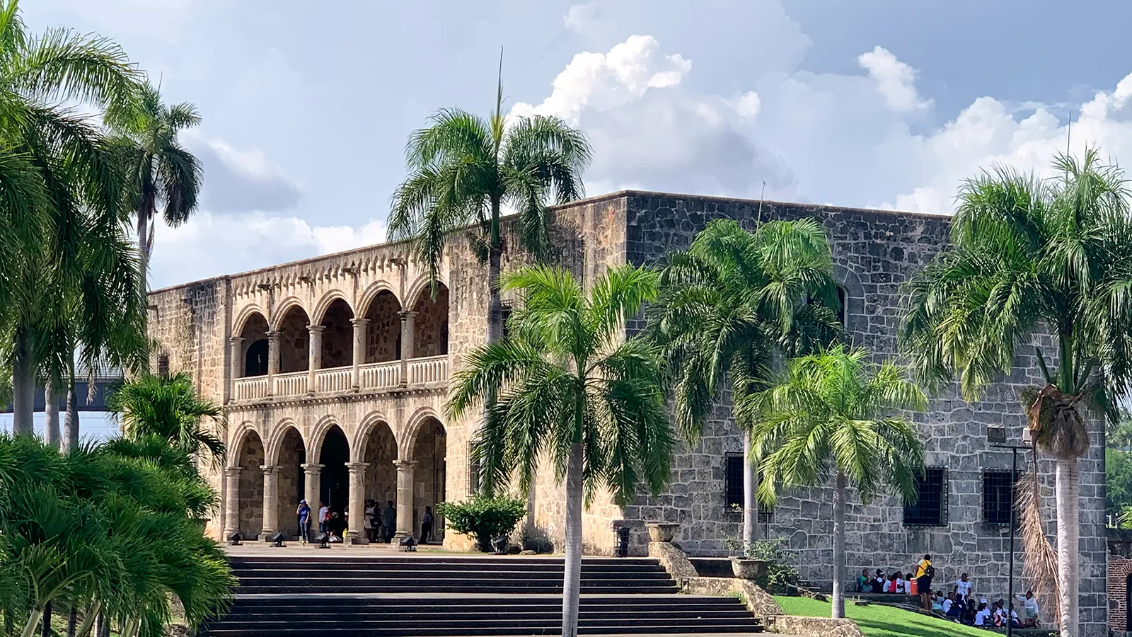 The historic stone Alcázar de Colón framed by palm trees in Santo Domingo's Colonial City