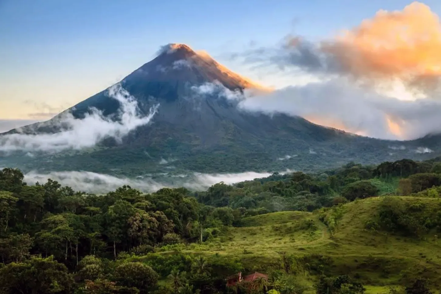 Arenal Volcano wreathed in mist and clouds in Costa Rica
