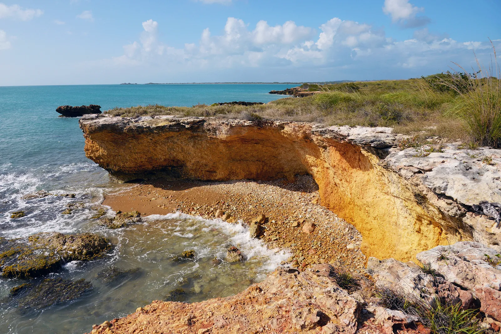 A rocky coastal cliff meeting the ocean in Puerto Rico