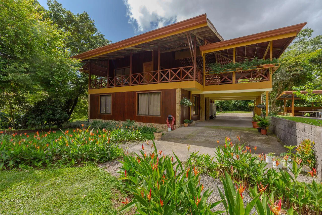A rainforest lodge building surrounded by garden greenery in Turrialba, Costa Rica