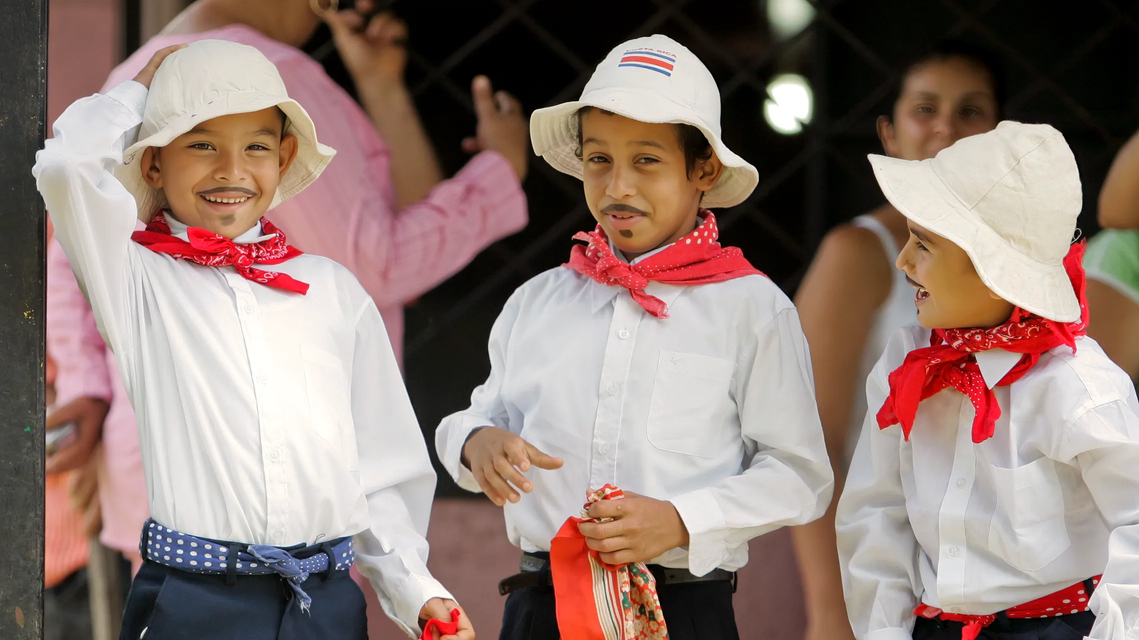 Children in traditional white-and-red folk costumes in Costa Rica