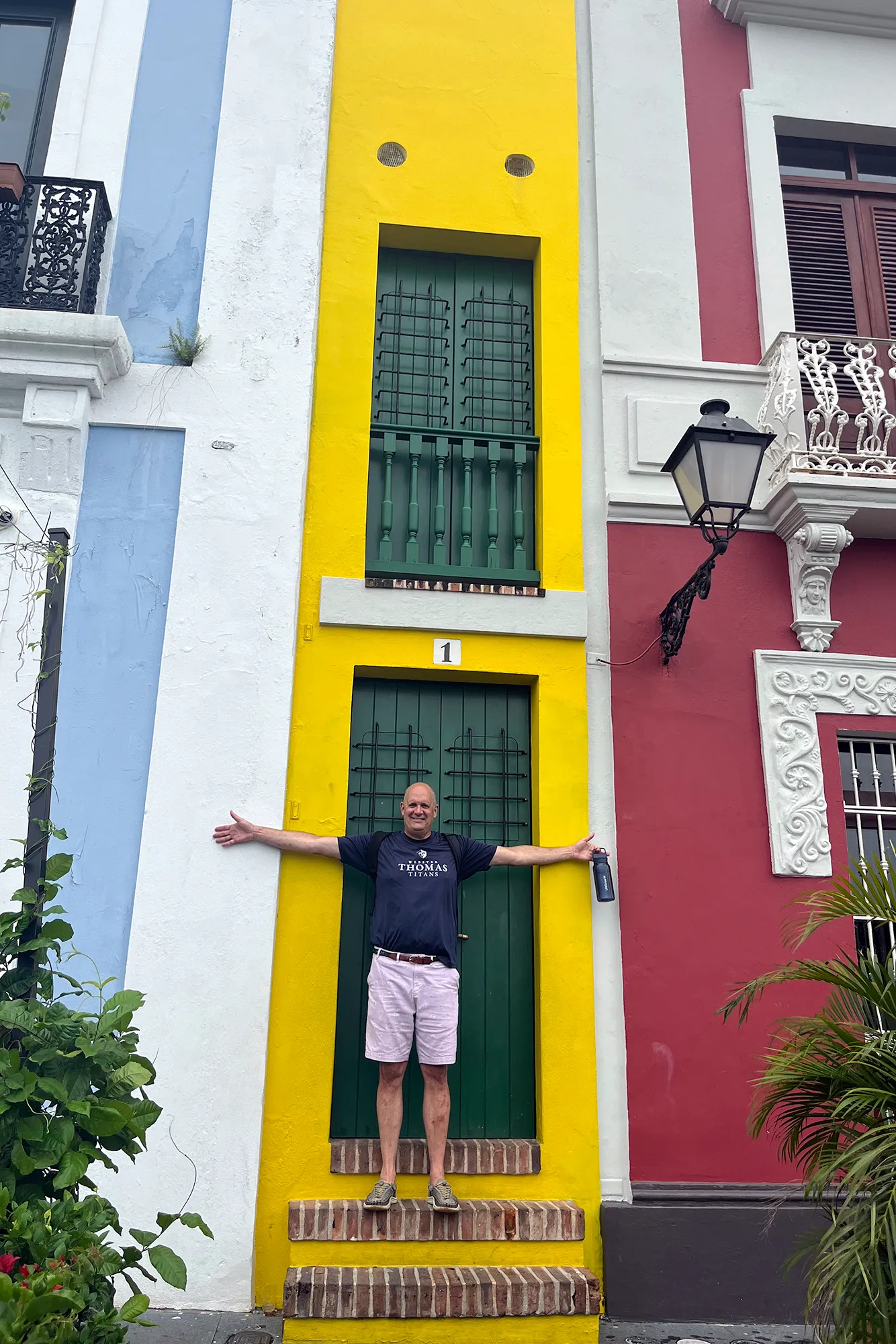 Brightly painted colonial building facades on a street in Old San Juan, Puerto Rico
