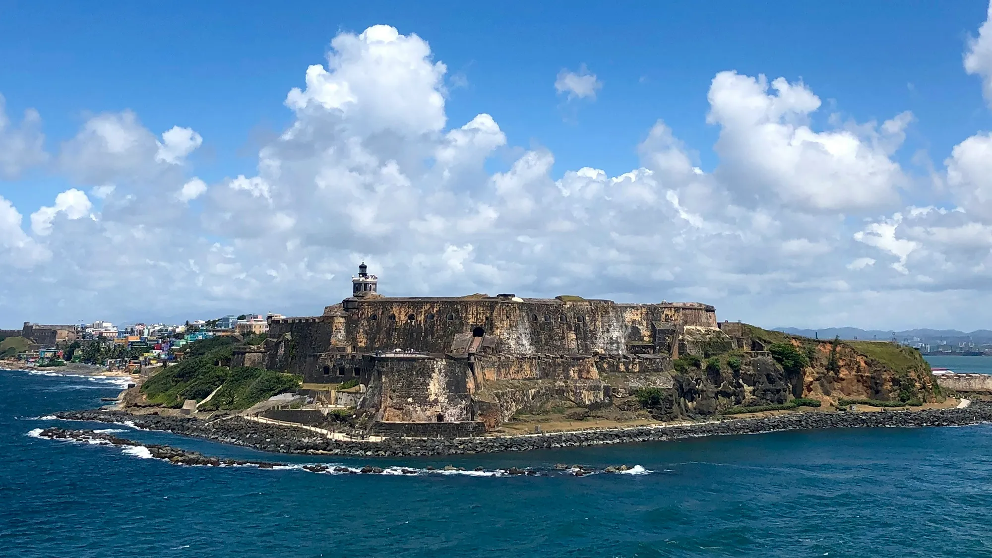A historic Spanish fort on a grassy point above the coast in San Juan, Puerto Rico