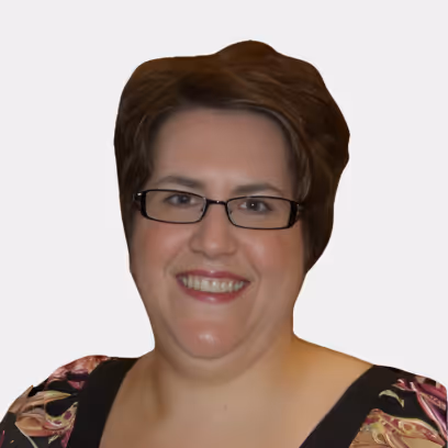 Smiling woman with short brown hair wearing glasses and a patterned top.