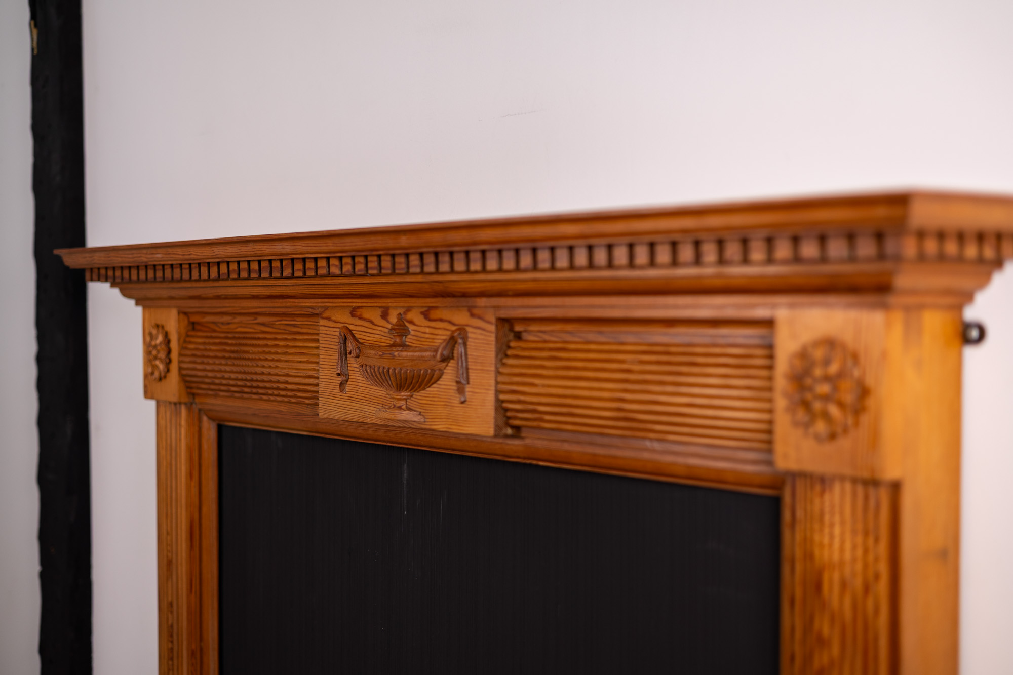 Fireplace and mantel in the property before renovation