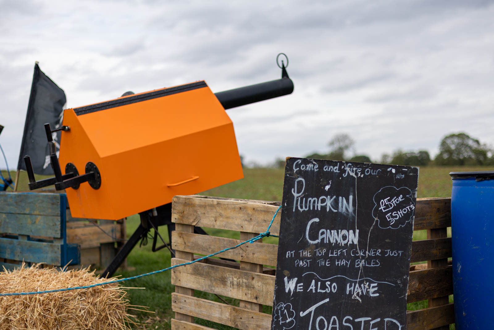 Pumpkin cannon and chalkboard sign at Overstone Grange Farm