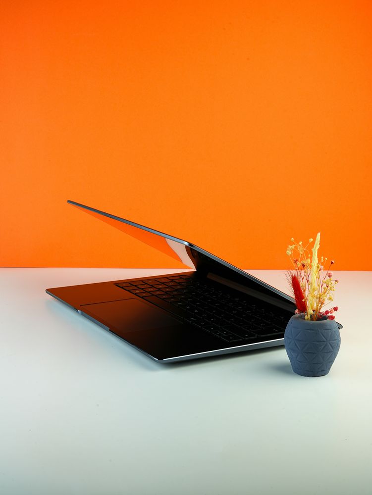 Paid search and SEO working together on a laptop.