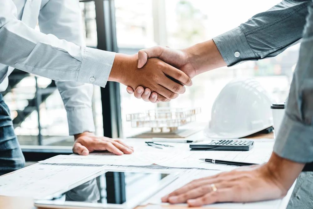 Two professionals shaking hands on a partnership