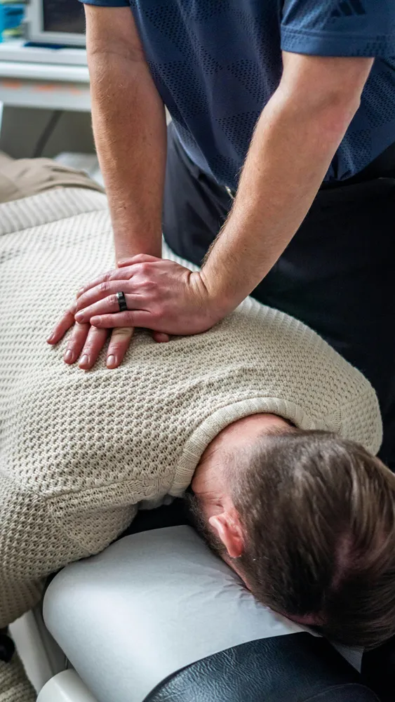 practitioner treating a patient's back