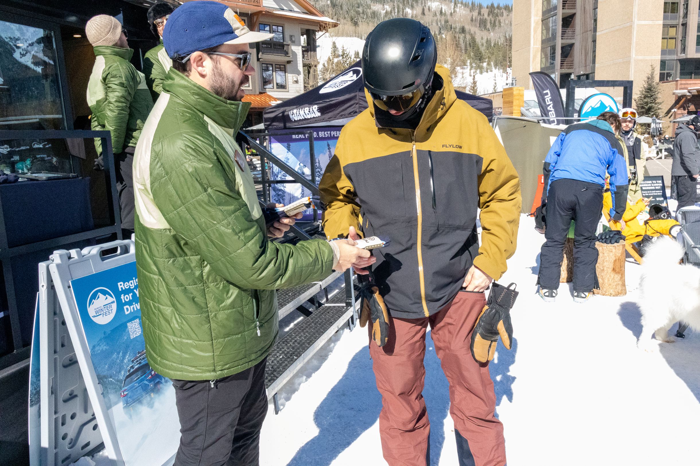 Photo of team members in front of a Lucid event for an autoshow.
