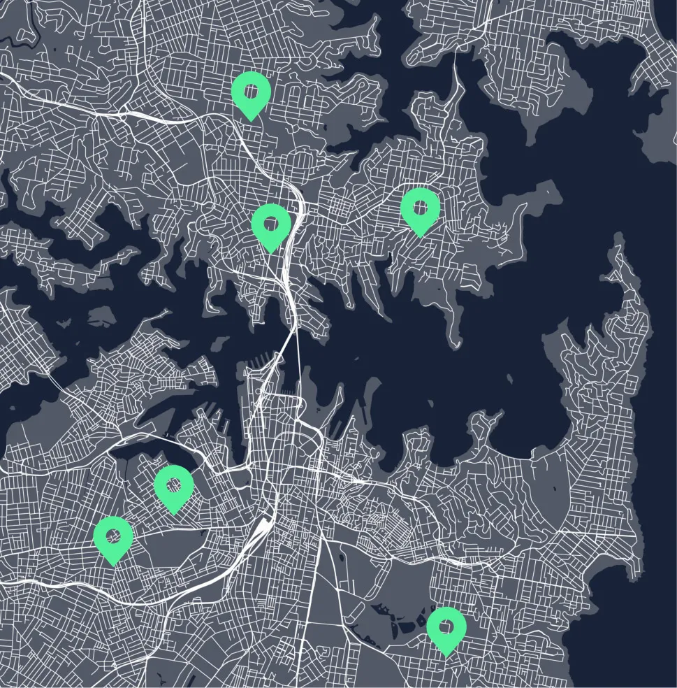 Map showing a city with highways and roads marked, featuring six green location pins spread across different neighborhoods.