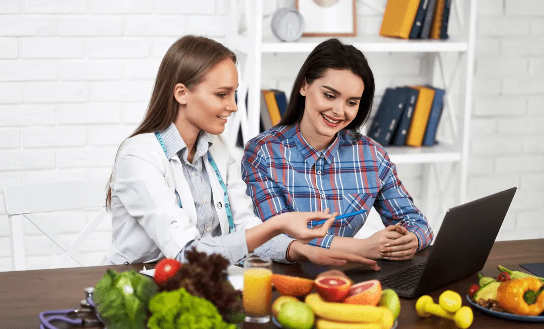  A Female Doctor Talking With A Female Patient