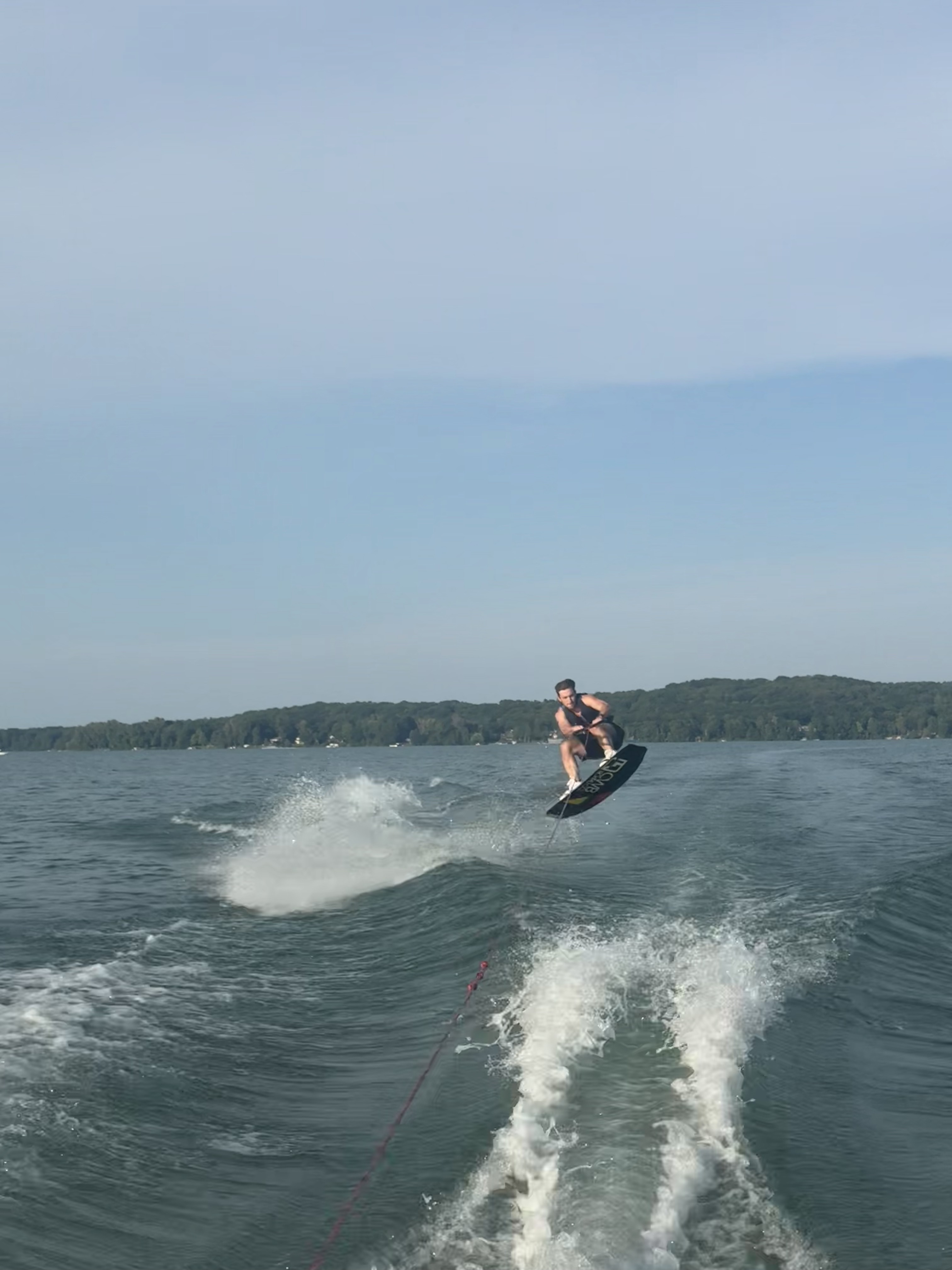 wooden trey with tea leaves in a white cup