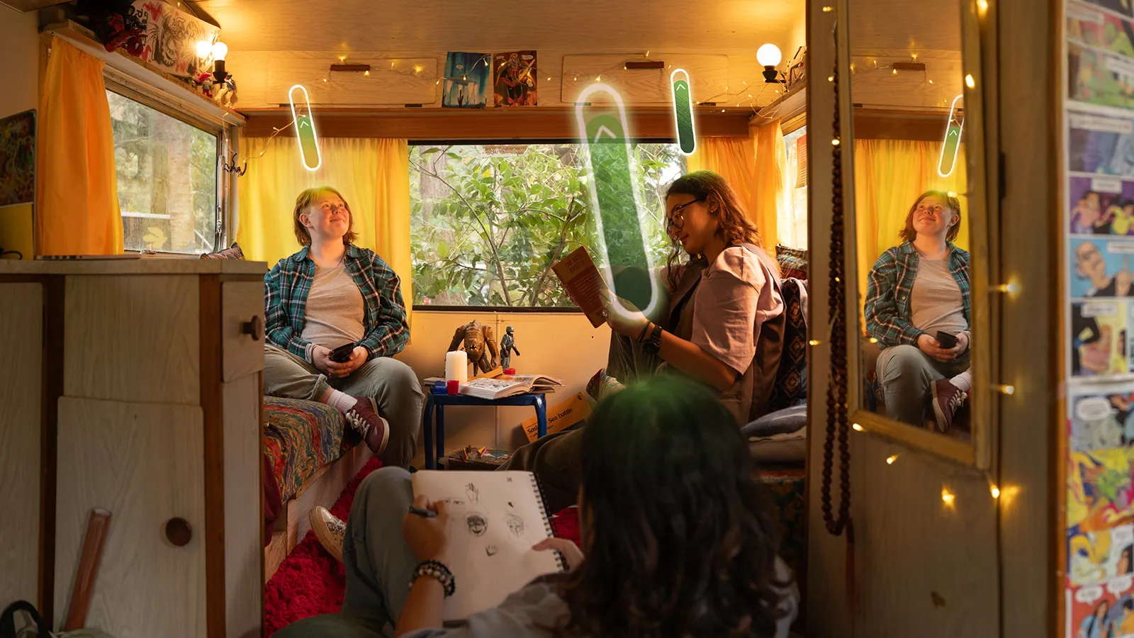 Three young people relaxing inside a cozy, brightly lit campervan. One person is drawing in a sketchbook, another is looking at a phone, and the third is reading a book.