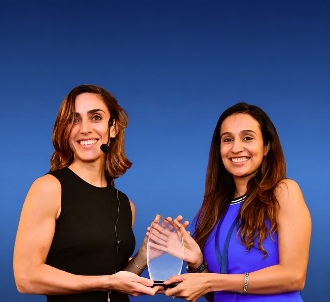 GoMasterCoach coaching award presentation with two professional coaches holding an ICF award