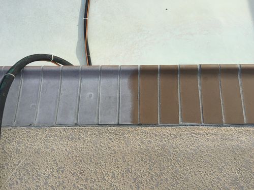 Concrete wall with precast panels and black electrical conduit pipes