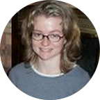 Smiling man and woman posing together outdoors in casual clothing.