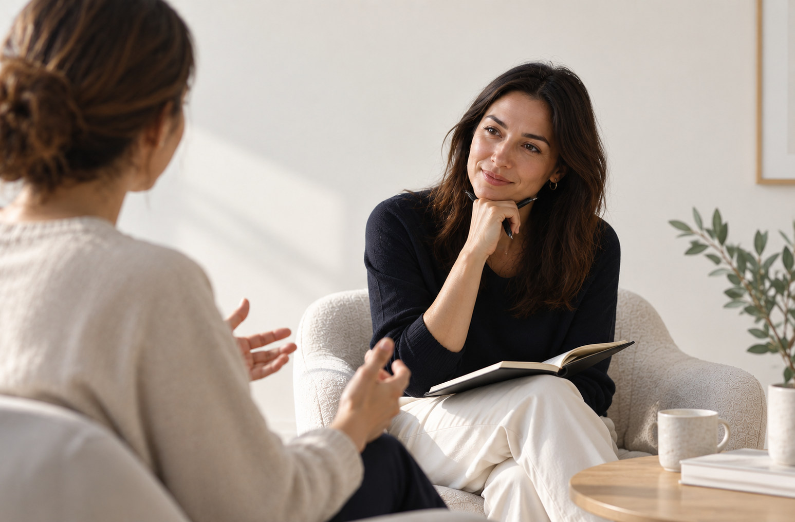 Coach listening to a client during a coaching session while choosing the right coaching model for the conversation