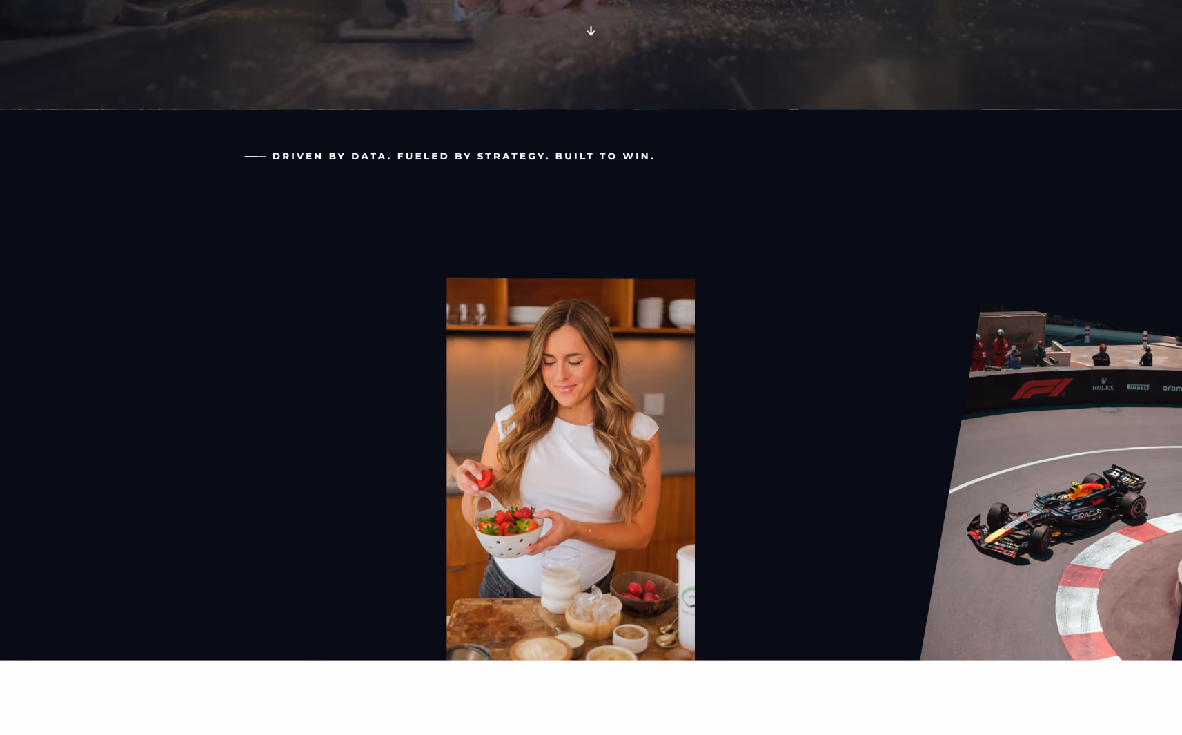 Woman in white top holding a colander full of strawberries in a kitchen setting with bowls and ingredients on the counter.