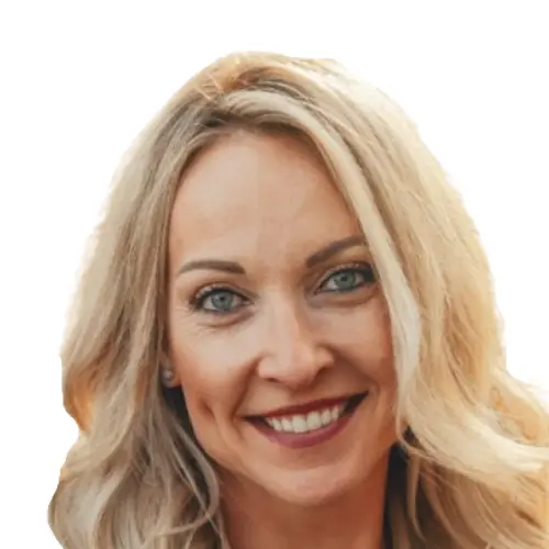 Smiling woman with long blonde hair and blue eyes against a white background.