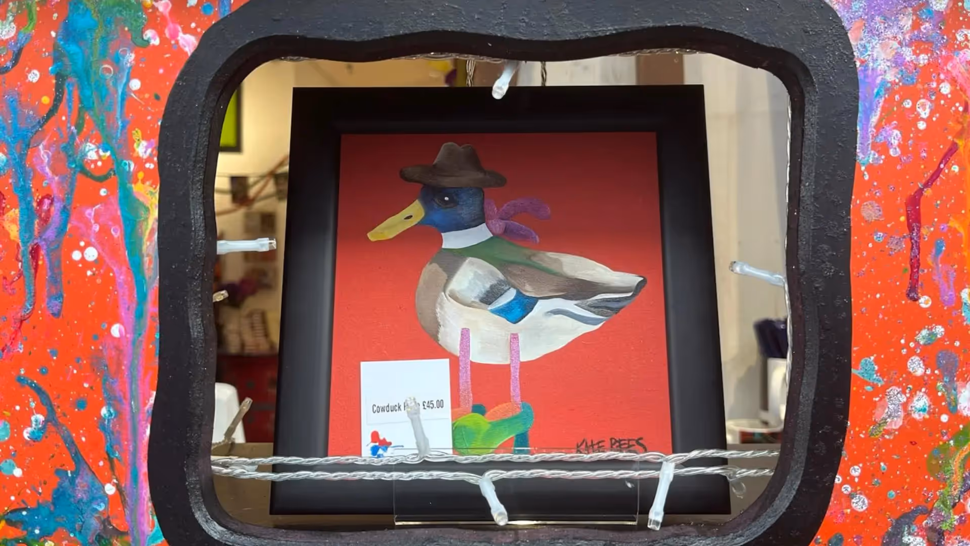 a framed picture of a duck