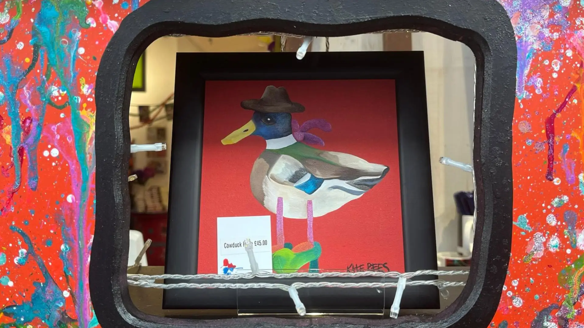 a framed picture of a duck