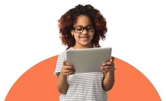 A young girl playing on her tablet