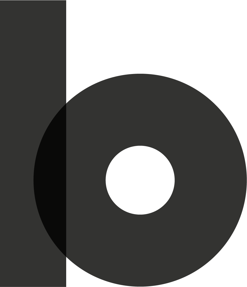 Black abstract geometric shapes including a vertical rectangle and a large hollow circle on a white background.