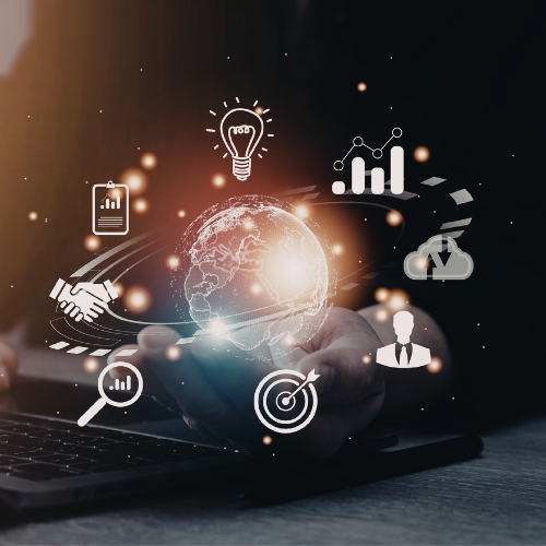 Hands holding a glowing digital Earth surrounded by business icons including graphs, a lightbulb, handshake, cloud upload, magnifying glass, target, and a user figure over a laptop keyboard.