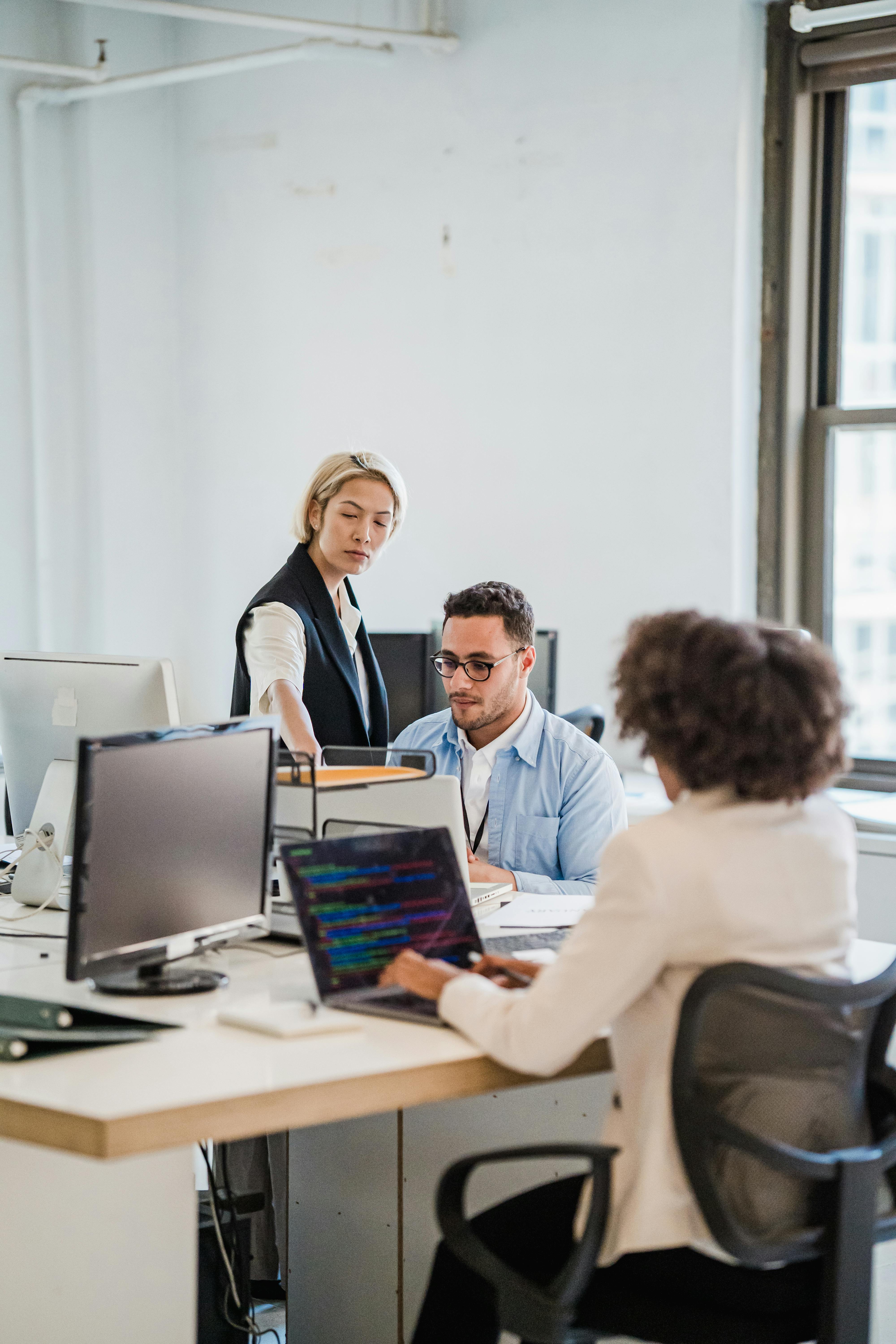 A team of staff working together in an office.