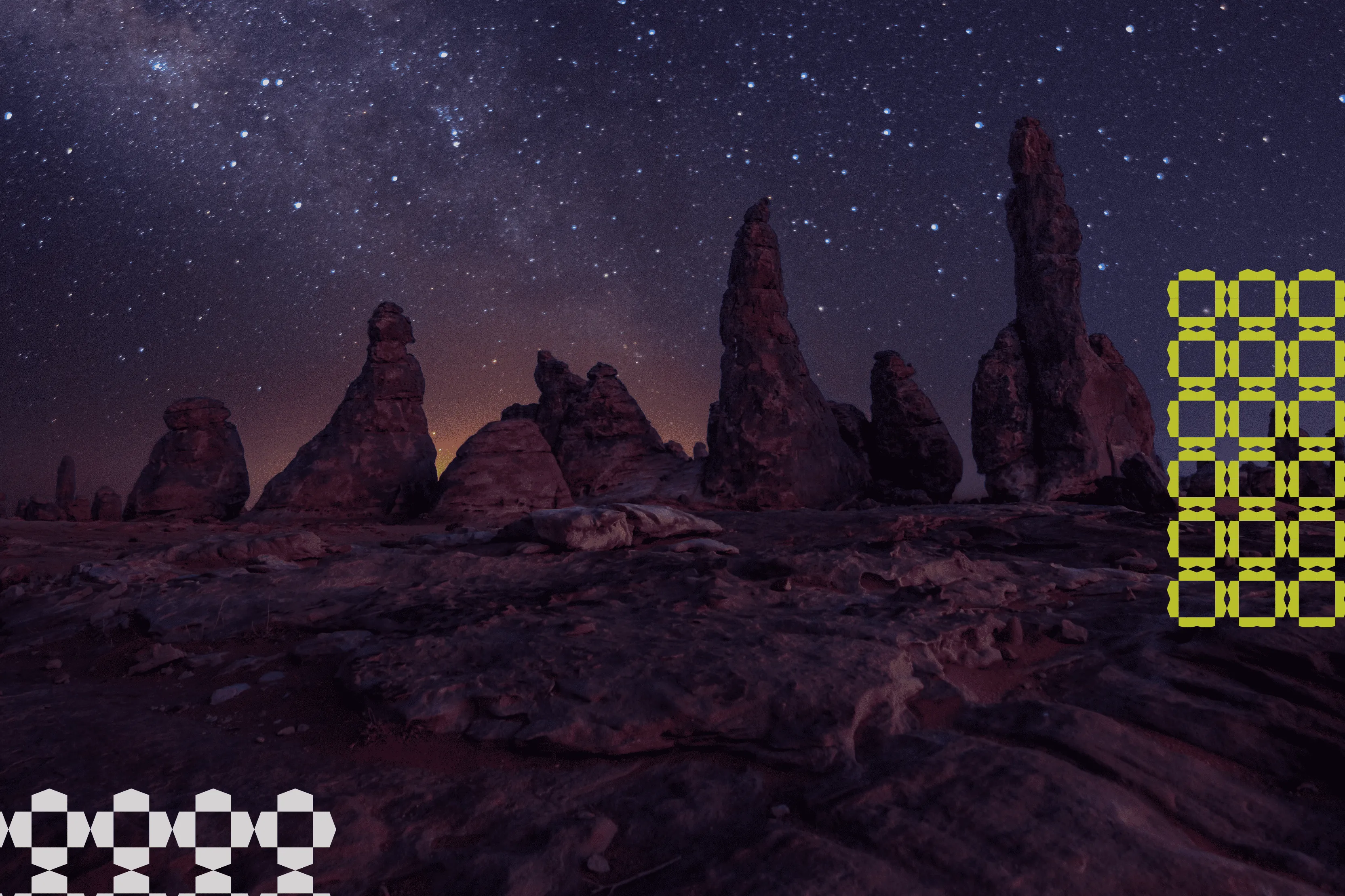 Rock formations silhouetted against a starry night sky with the Milky Way visible.
