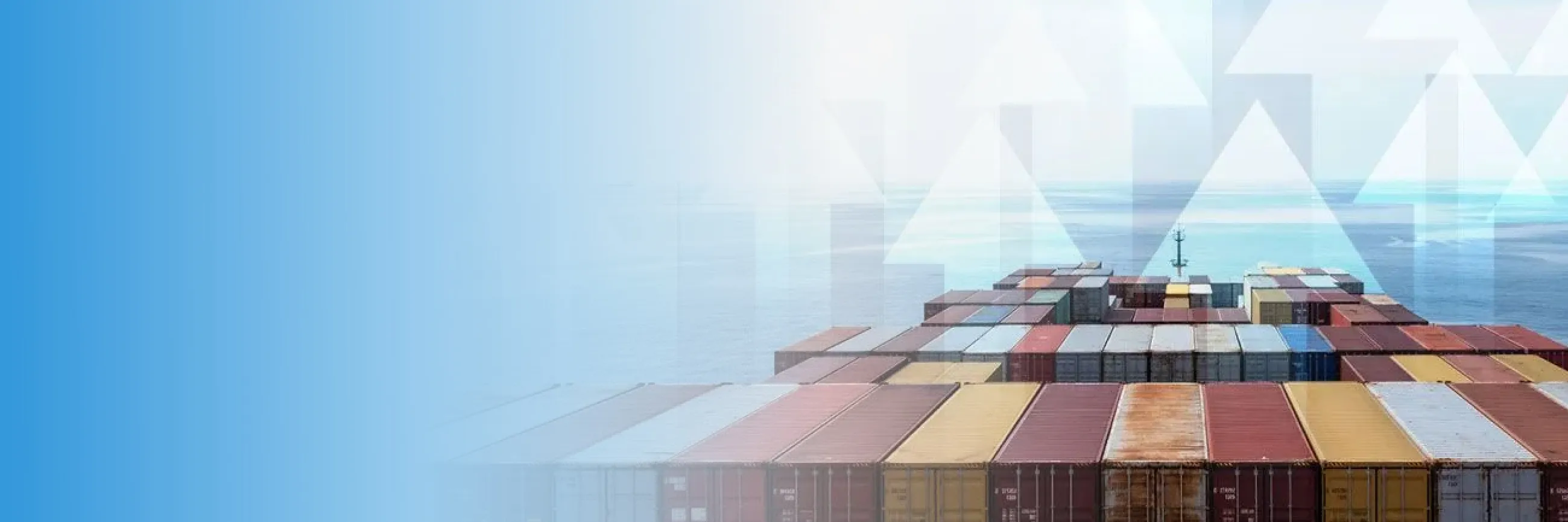 View over the deck of a cargo ship loaded with colorful shipping containers sailing on the ocean.