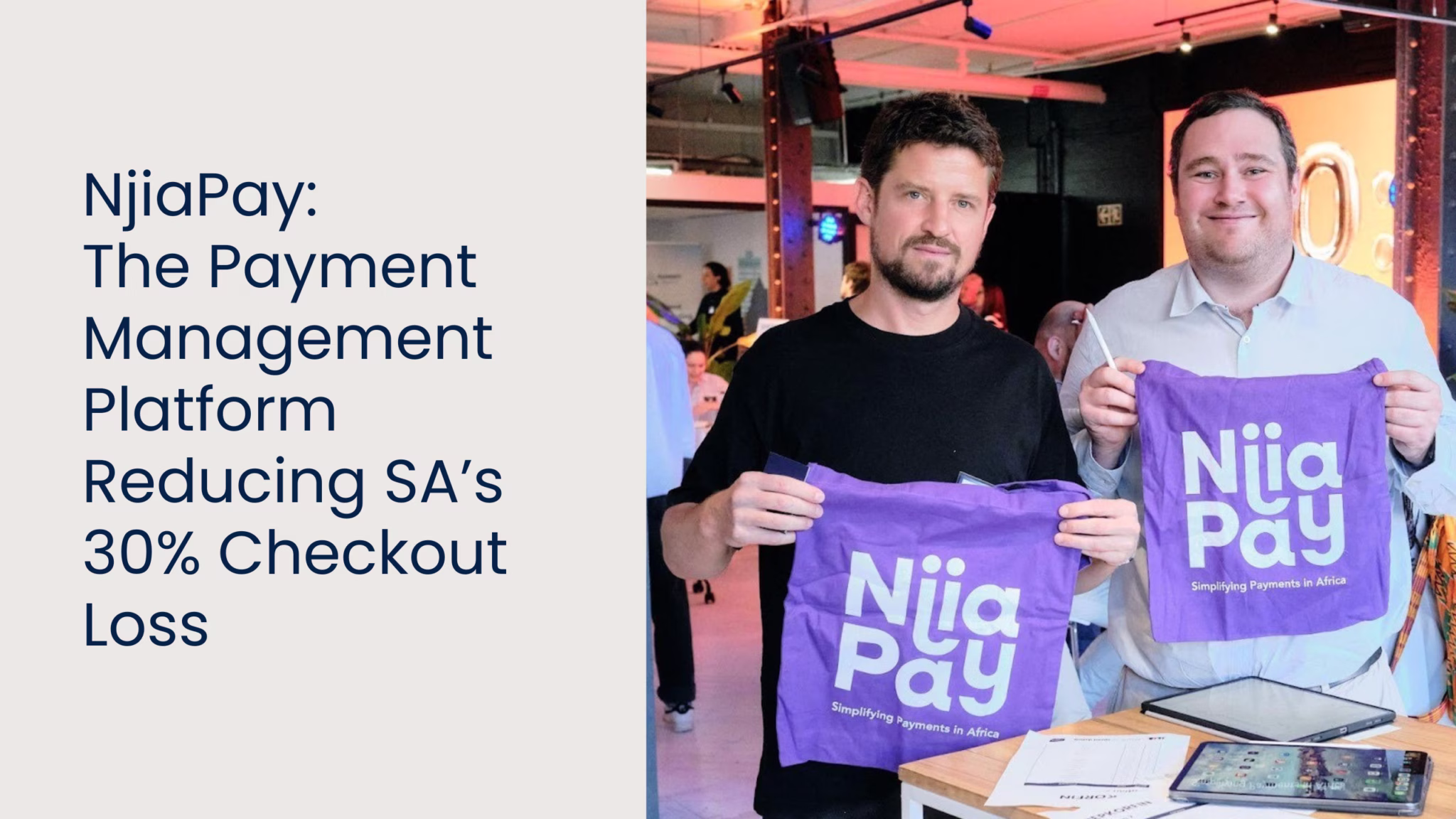 Two men holding purple bags with NiiaPay logo and slogan 'Simplifying Payments in Africa' in an office setting.