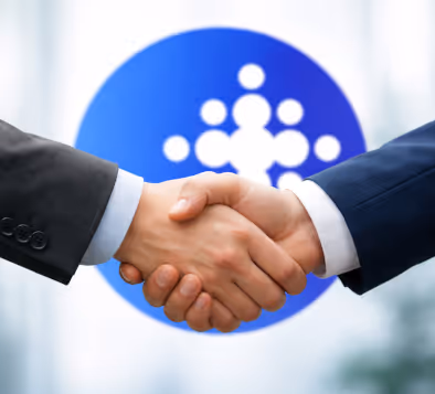 Two people in business suits shaking hands in front of a blue circular logo with white interconnected dots.