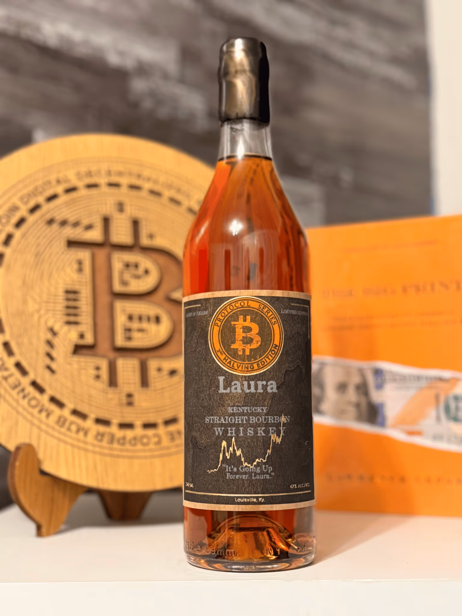 Laura Bourbon Bottle In Front Of Larry Lepard's Big Print 