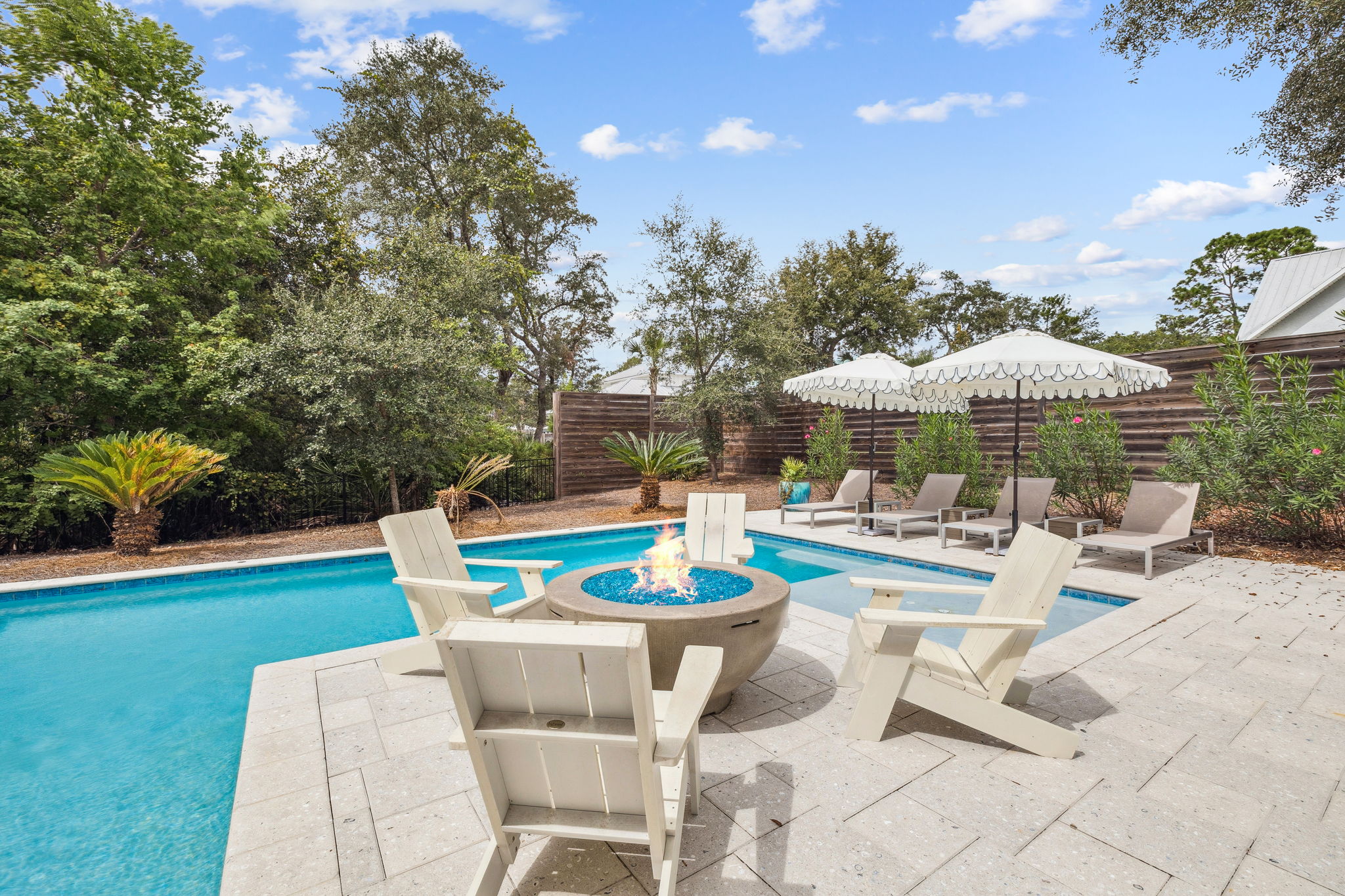 Private pool with fire pit and outdoor seating at a 30A vacation rental home