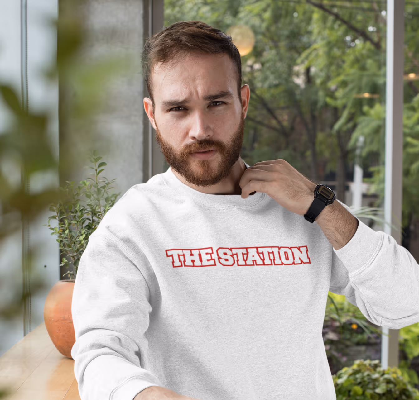 Man wearing a custom printed sweatshirt showcasing casual branded clothing.