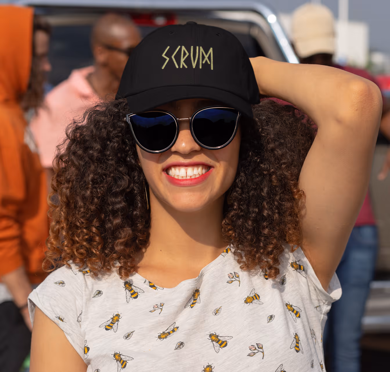 Woman wearing a custom branded hat and shirt highlighting lifestyle apparel printing.